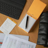 Our famous, French-made, 80g, ultra white and super smooth paper now in desk memo form. Choose from a boxed set (one pad and one iconic orange logo box), or a single pad that's handsome enough to be used alone or as a box refill. Makes a compact and handy desk accessory!

Comes in a refillable protective box.

Size: 4-1/8 x 5-7/8
Detachable Sheets: 240
Paper/Color: 80g/Ultra White
Fountain pen and marker friendly
Exceptionally smooth, acid-free, pH neutral
Cardboard backed, nonskid backing