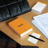 Our famous, French-made, 80g, ultra white and super smooth paper now in desk memo form. Choose from a boxed set (one pad and one iconic orange logo box), or a single pad that's handsome enough to be used alone or as a box refill. Makes a compact and handy desk accessory!

Comes in a refillable protective box.

Size: 4-1/8 x 5-7/8
Detachable Sheets: 240
Paper/Color: 80g/Ultra White
Fountain pen and marker friendly
Exceptionally smooth, acid-free, pH neutral
Cardboard backed, nonskid backing