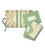 A prettier stationery stash, perfect for writing on the go. Printed with Garden Study florals in six individual designs, this folio-style set includes 12 notecards (two of each design) with matching envelopes, tucked inside a coordinating folder with a ribbon-tie closure.