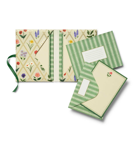 A prettier stationery stash, perfect for writing on the go. Printed with Garden Study florals in six individual designs, this folio-style set includes 12 notecards (two of each design) with matching envelopes, tucked inside a coordinating folder with a ribbon-tie closure.