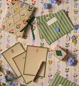 A prettier stationery stash, perfect for writing on the go. Printed with Garden Study florals in six individual designs, this folio-style set includes 12 notecards (two of each design) with matching envelopes, tucked inside a coordinating folder with a ribbon-tie closure.