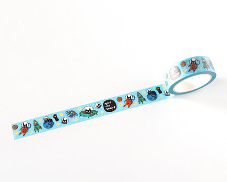 Decorative washi tape featuring playful illustrated cats in space, including astronauts, planets, and stars. Perfect for planners, journals, gift wrapping, scrapbooking, and creative projects. Easy to tear, repositionable, and residue-free.

🌈 Key Features:

Dimensions: 15mm wide x 10 meters (32.8 feet) in length&nbsp;
Contains: 1 washi tape roll

High-quality washi tape material
Easy to tear and reposition
Perfect for scrapbooking, journaling, and crafts
