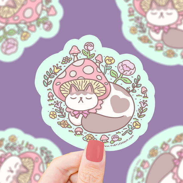 Ah, to be a cat in a mushroom cap, napping in the forest.