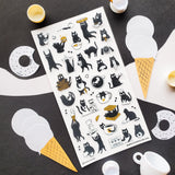 ☕🐈 Chaos is brewing at this tiny cat café! These busy little beans are pouring coffee, stacking waffles, slurping noodles, and sneaking bites between orders. From barista duties to snack-time shenanigans, every kitty is hard at work (or hardly working). Add these mischievous café cats to your pages for a sprinkle of cozy chaos and extra espresso energy.

Top Coating: None
Adhesive Layer: PVC (plastic)
Backing Layer: Clear PET
6.69" x 3.54".
Weight - 0.03lbs.
1 sheet included &nbsp; &nbsp;