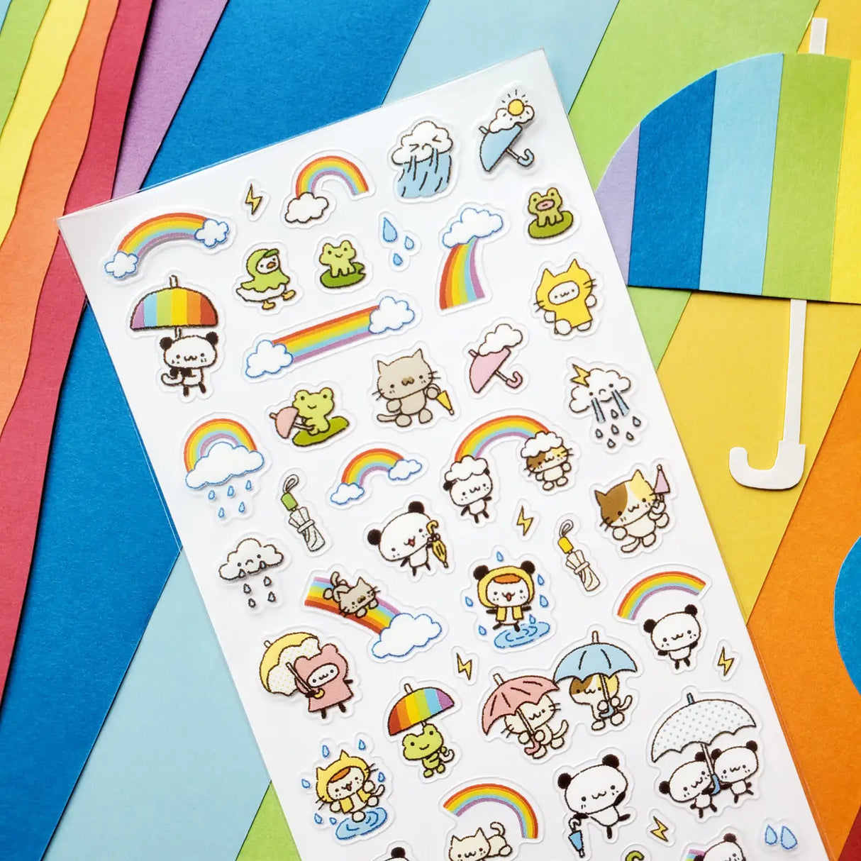 🌈☂️ A little rain makes room for rainbows in this adorable sheet featuring cheerful pandas, kitties, and froggies! From splashing in puddles to sharing umbrellas and sliding down bright rainbows, these friends turn every drizzle into a playful adventure.