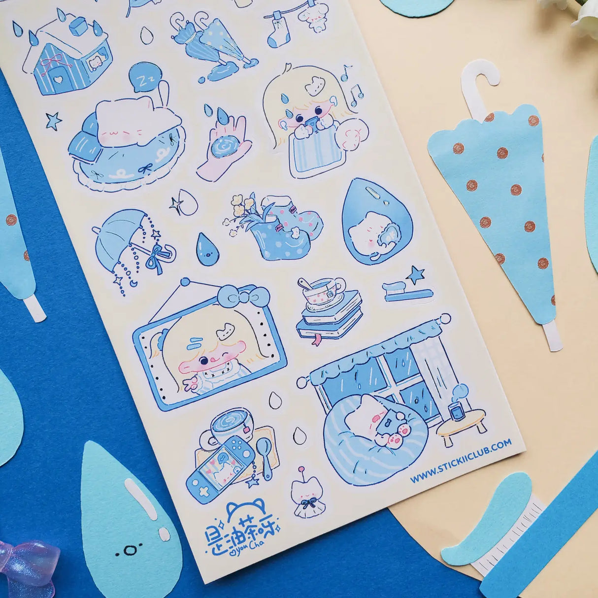 ☔💙 Cozy up and let the rain fall with this soothing blue-toned sheet! Filled with sleepy cats, soft blue umbrellas, rainy windows, warm drinks, and quiet little indoor moments, it captures all the best parts of a slow rainy day. Perfect for anyone who loves the peaceful magic of staying in, getting comfy, and listening to the gentle sound of raindrops outside.
