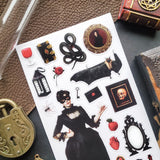 🕯️🦇 Step into a shadowy parlor of vintage gothic charm with this hauntingly elegant sticker sheet. From mysterious masked figures and candlelit curiosities to ravens, roses, serpents, and forbidden tomes, every piece feels plucked from an old-world cabinet of wonders. Perfect for adding a touch of dark romance, eerie beauty, and timeless intrigue to your spreads and creations.