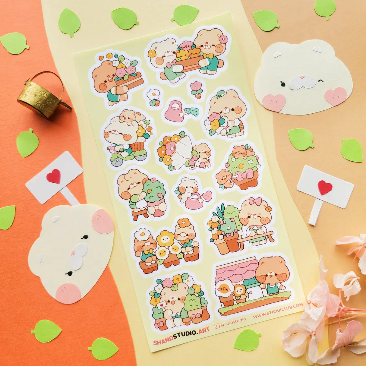 🐻💐 Step into @shandstudio’s blooming bear garden, where flower-loving friends spend their days planting seeds, watering blossoms, and sharing the prettiest petals around! From building cheerful bouquets to caring for potted plants and spreading joy one bloom at a time, this sheet will fill your pages with nonstop sunshine and smiles!

Art by: @shandstudio

Top Coating: None
Adhesive Layer: Paper
Backing Layer: Clear PET
6.69" x 3.54".
Weight - 0.03lbs.
1 sheet included