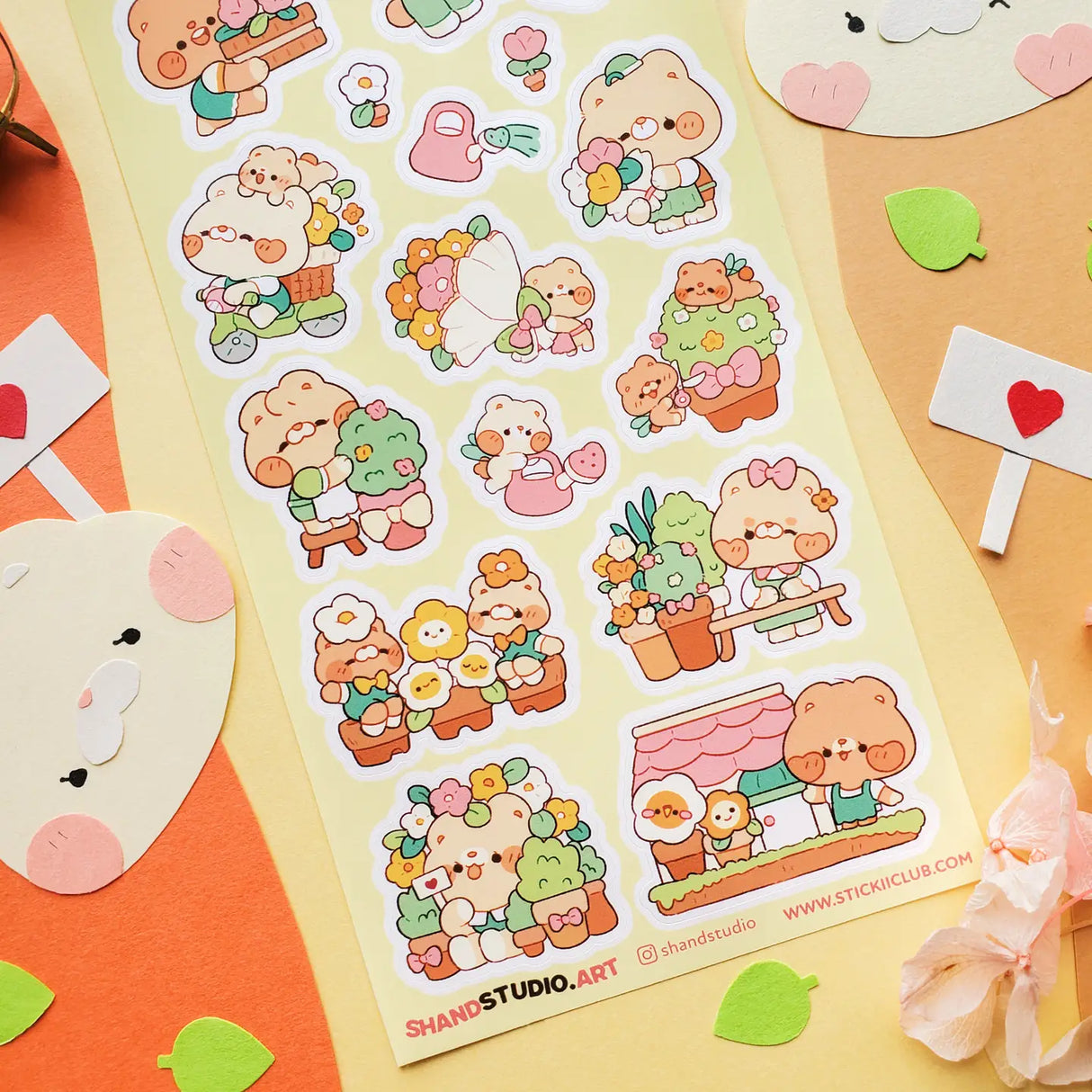 🐻💐 Step into @shandstudio’s blooming bear garden, where flower-loving friends spend their days planting seeds, watering blossoms, and sharing the prettiest petals around! From building cheerful bouquets to caring for potted plants and spreading joy one bloom at a time, this sheet will fill your pages with nonstop sunshine and smiles!

Art by: @shandstudio

Top Coating: None
Adhesive Layer: Paper
Backing Layer: Clear PET
6.69" x 3.54".
Weight - 0.03lbs.
1 sheet included