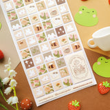 🌻🐝 Buzz on over to @bunnybee.garden’s whimsical garden, where chubby bunny-bees flutter through fields of flowers and cozy mushroom hideaways. From watering plants and zooming past blooming petals to splashing in puddles and snoozing in grassy corners, this sheet is bee-yond adorable.


Art by: @bunnybee.garden

Top Coating: None
Adhesive Layer: Paper
Backing Layer: Clear PET
6.69" x 3.54".
Weight - 0.03lbs.
1 sheet included