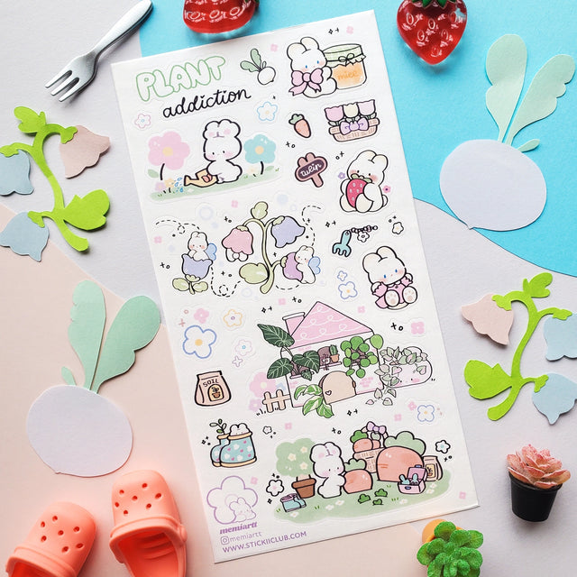 🌱🐰 In @memiartt’s cozy little plant paradise, bunny gardeners nurture with love, muddy paws, and lots of happy hops! From cuddling flowers and mixing soil to watering sprouts, potting leafy friends, and sneaking carrot snack breaks, these bunnies are always busy growing something wonderful that makes this sheet burst with garden magic!

Art by: @memiartt

Top Coating: None
Adhesive Layer: Paper
Backing Layer: Paper
6.69" x 3.54".
Weight - 0.03lbs.
1 sheet included 