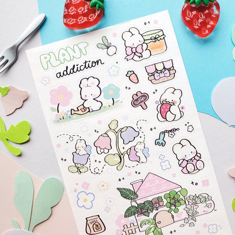 🌱🐰 In @memiartt’s cozy little plant paradise, bunny gardeners nurture with love, muddy paws, and lots of happy hops! From cuddling flowers and mixing soil to watering sprouts, potting leafy friends, and sneaking carrot snack breaks, these bunnies are always busy growing something wonderful that makes this sheet burst with garden magic!

Art by: @memiartt

Top Coating: None
Adhesive Layer: Paper
Backing Layer: Paper
6.69" x 3.54".
Weight - 0.03lbs.
1 sheet included 
