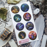 🌙🐲 Bathed in moonlight, @gracemerewoods’ dragons stand watch as gentle guardians of ancient forests, glowing gateways, and sacred firelight. Each scene reveals their role as protectors of balance, beauty, and magic. With dreamy brushwork, luminous atmosphere, and timeless fantasy charm, this sheet brings the legend of these mystical keepers to life.

&nbsp;Art by: @gracemerewoods

Top Coating: Gold Foil
Adhesive Layer: Paper
Backing Layer: Clear PET
6.69" x 3.54".
Weight - 0.03lbs.
1 sheet included