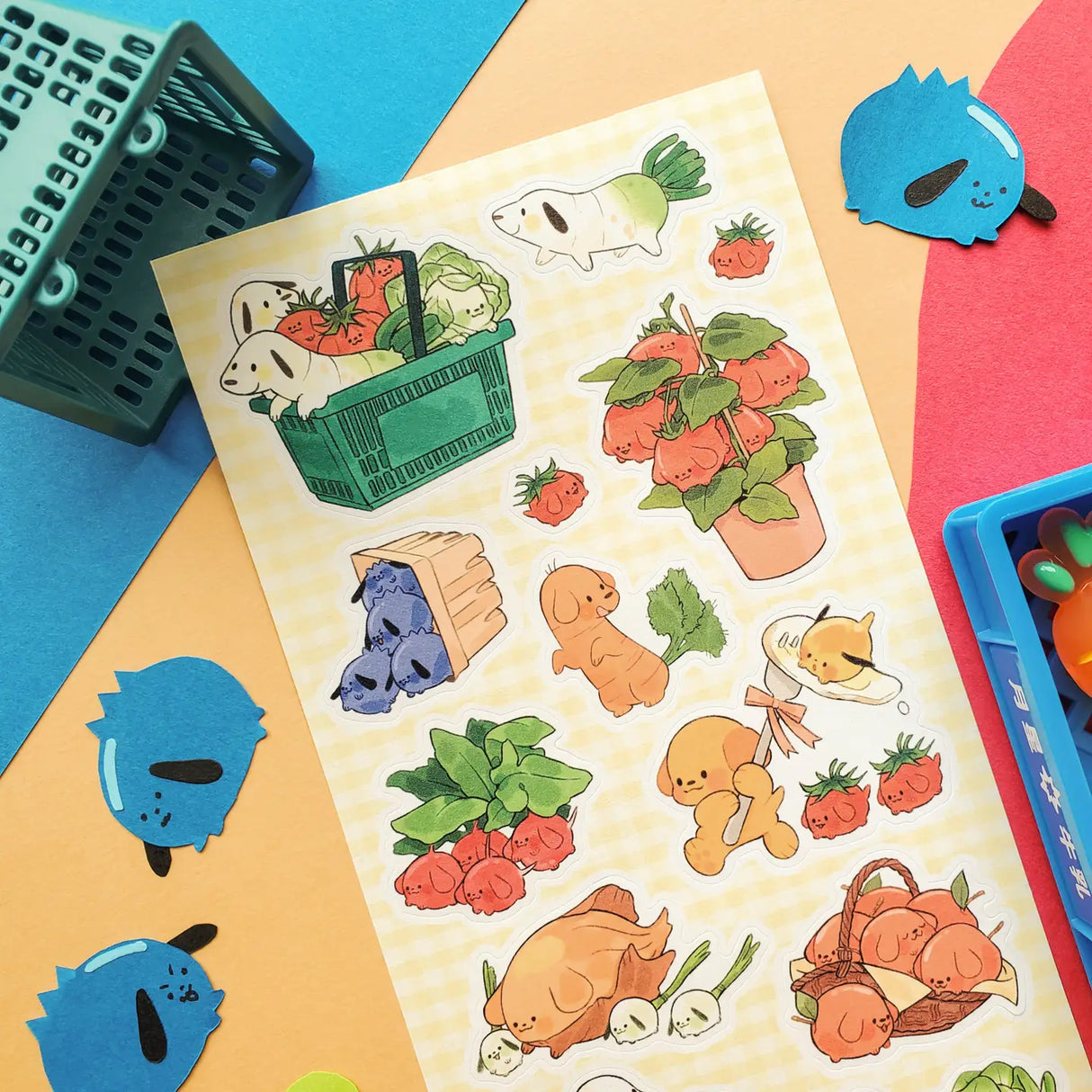 🥕🐶 Let’s go to the cutest farmers market ever with @yumbrite’s veggie pups! From carrot doggos zooming around with leafy greens to tomato buddies piling into produce baskets, these pals take “farm to table” fun very seriously. Packed with fresh produce, playful pups, and wholesome charm, this sheet has us excited for our greens!

Art by: @yumbrite

Top Coating: None
Adhesive Layer: Paper
Backing Layer: Paper
6.69" x 3.54".
Weight - 0.03lbs.
1 sheet included 