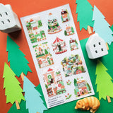 🎄🏡 Welcome to @hogletandco’s cozy winter village! From twinkling carousels to snowy cottages and curious cats by snowy windows, this charming town is brimming with holiday cheer. Take a stroll through festive markets, peek into storybook shops, and watch the magic of the season unfold.

Top Coating: None
Adhesive Layer: PVC (plastic)
Backing Layer: Clear PET
6.69" x 3.54".
Weight - 0.03lbs.
1 sheet included&nbsp;