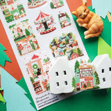 🎄🏡 Welcome to @hogletandco’s cozy winter village! From twinkling carousels to snowy cottages and curious cats by snowy windows, this charming town is brimming with holiday cheer. Take a stroll through festive markets, peek into storybook shops, and watch the magic of the season unfold.

Top Coating: None
Adhesive Layer: PVC (plastic)
Backing Layer: Clear PET
6.69" x 3.54".
Weight - 0.03lbs.
1 sheet included&nbsp;