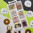 🪙🐸 Luck meets mischief in this enchanting sheet by @nantoka_keiko. In this wild festival of fortune: coin-loving frogs, dancing skeletons, and quirky spirit creatures stack coins, ring bells, and summon good vibes in the most unexpected ways. Stick them anywhere you need a boost of magic, sparkle, and playful fortune!

Art by: @nantoka_keiko