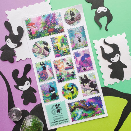 🌳🍄 Stamp your passport and hang on to it tight or one of these cuties might get curious! This whimsical sheet by @pabkins features curious little forest spirits that dart between mushrooms, bottle secret spells, ride friendly snails, and splash through ancient streams. They got a penchant for exploring, and they want you to join (sometimes unknowingly!)

&nbsp;Art by: @pabkins

Top Coating: Silver foil&nbsp;
Adhesive Layer: Paper&nbsp;
Backing Layer: Clear PET
6.69" x 3.54".
Weight - 0.03lbs.
1 sheet incl