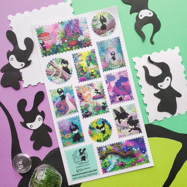 🌳🍄 Stamp your passport and hang on to it tight or one of these cuties might get curious! This whimsical sheet by @pabkins features curious little forest spirits that dart between mushrooms, bottle secret spells, ride friendly snails, and splash through ancient streams. They got a penchant for exploring, and they want you to join (sometimes unknowingly!)

&nbsp;Art by: @pabkins

Top Coating: Silver foil&nbsp;
Adhesive Layer: Paper&nbsp;
Backing Layer: Clear PET
6.69" x 3.54".
Weight - 0.03lbs.
1 sheet incl
