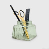 An oversized pen pot designed in the style of a classic inkwell. Made from green-tinted soda glass with plenty of space for your writing tools.

Classic glass pencil pot.
Green tinted soda glass.
Organize your writing tools.
Modern take on a timeless classic.
Pretend you are a Victorian scholar.
Plastic free product and packaging