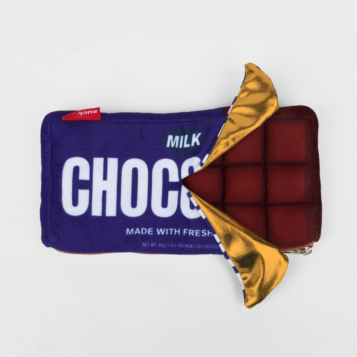 Plush chocolate bar shaped case with gold zip. Store your belongings in style by tucking them into this sweet treat. Yum!

Juicy, tasty, sweet and sour. And very cute. Stuff your stuff into something soft, and squishy. Delicious looking plush zip pouches look like foodie treats but instead of calories, they hold your everyday essentials. From cheesy slices to sickly treats, each pouch is designed to be irresistible and practical. Perfect for pens, cables, cosmetics, or whatever bits and bobs you need to sta