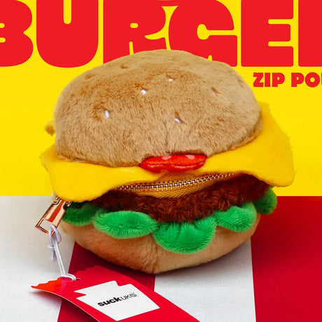 SUCK UK Plush Pouch - Hamburger

Plush burger shaped case with gold zip. Store your belongings amongst the salad and the melted cheese. Yum!

Juicy, tasty, sweet and sour. And very cute. Stuff your stuff into something soft, and squishy. Delicious looking plush zip pouches look like foodie treats but instead of calories, they hold your everyday essentials. From cheesy slices to sickly treats, each pouch is designed to be irresistible and practical. Perfect for pens, cables, cosmetics, or whatever bits and b