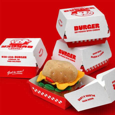 SUCK UK Plush Pouch - Hamburger

Plush burger shaped case with gold zip. Store your belongings amongst the salad and the melted cheese. Yum!

Juicy, tasty, sweet and sour. And very cute. Stuff your stuff into something soft, and squishy. Delicious looking plush zip pouches look like foodie treats but instead of calories, they hold your everyday essentials. From cheesy slices to sickly treats, each pouch is designed to be irresistible and practical. Perfect for pens, cables, cosmetics, or whatever bits and b