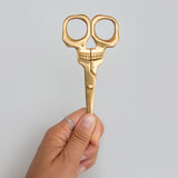 SUCK UK Skull Scissors

Shockingly sharp stainless-steel scissors with a brass finish. From hair-raising haircuts to creepy paper crafts, these heavy-duty general use scissors are both handy and haunting in equal measure. For all eerie everyday tasks, these handy and haunting scissors are tough yet precise. Truly multipurpose, use them to trim your plants, snip your needlework, or even groom your facial hair. Durable stainless steel blades and full metal construction allows them to cut through fabric, paper