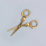 SUCK UK Skull Scissors

Shockingly sharp stainless-steel scissors with a brass finish. From hair-raising haircuts to creepy paper crafts, these heavy-duty general use scissors are both handy and haunting in equal measure. For all eerie everyday tasks, these handy and haunting scissors are tough yet precise. Truly multipurpose, use them to trim your plants, snip your needlework, or even groom your facial hair. Durable stainless steel blades and full metal construction allows them to cut through fabric, paper