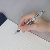 The Sailor Pro Gear Transparent fountain pen has a clear barrel with silver trim. The pen has been fitted with a 14k solid gold nib that has been rhodium plated to match.

Pro Gear Slim size
14k gold nib with Rhodium plating
Includes 2 proprietary black ink cartridge and 1 converter