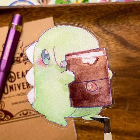 Feed Me Dino thought his Journal Cover looked like chocolate but it tasted like leather...He still loves it, though. He keeps track of his favorite places to eat inside.

Dimensions:&nbsp;

2.25in x 2.5in

Material

P.E.T (oil proof, UV resistant, and waterproof)