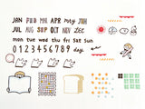 These stamps are just what you're looking for to start a new notebook at the beginning of the year! 963hanko's cute letters such as the month, day of the week, and numbers, weather marks, dogs of joy, anger, sorrow, and other motifs and patterns that can also be used as date labels. As the name of the stamp of "Planning Buddy" suggests, it's sure to be your buddy!