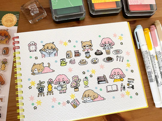 It starts with being woken up by an alarm clock, eating, drinking, watering flowers, enjoying notebook time, reading, and rumbling. Pepper's expression and gestures are very adorable stamps. My partner cat is also cute! It is practical and easy to use as a notebook.

This stamp set is a collaboration between Sakuralala and Love Soup, an Australian artist based in Japan that illustrates pictures of Lazy Girl Pepper. These stamps are the perfect addition for your journal or planner!
