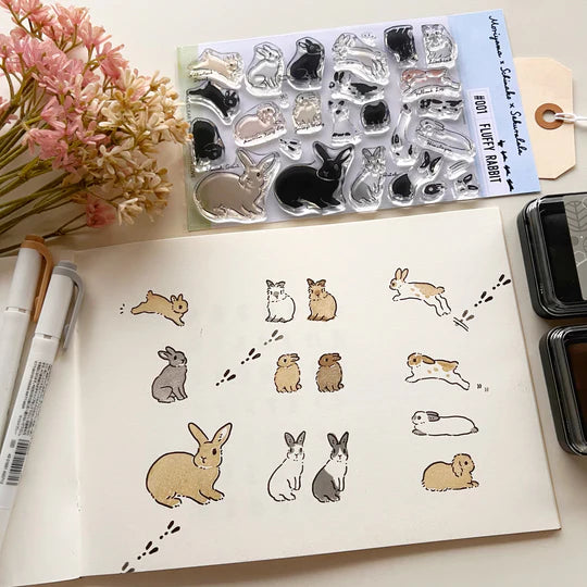 This collaboration with Moriyama, who has a wonderful shop in Ota Ward, Tokyo, and Shiko Moriyama, an illustrator who draws adorable rabbits.

"Fluffy Rabbit" is a clear stamp in the style of a rabbit's encyclopedia. It is divided into 10 types of rabbit base outline stamps, such as Netherland Dwarf, Holland Drop, and Flemish Giant, and coloring stamps that serve as patterns. You can stamp it in any color you like, so if you have a rabbit in your family, please try stamping it in the color of "my child"!
