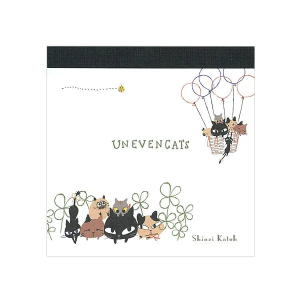 Shinzi Katoh Memo Pad - Uneven Cats Clover Illustrated book cover with cats and a hot air balloon, featuring the title 'Unevengats' and artist's name.
