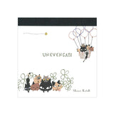 Shinzi Katoh Memo Pad - Uneven Cats Clover Illustrated book cover with cats and a hot air balloon, featuring the title 'Unevengats' and artist's name.