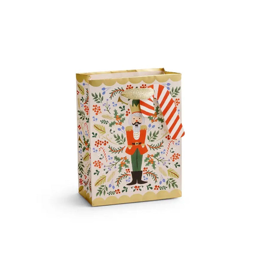 Giving gets even more special with our gift bags, which feature charming extras like gold foil accents, cotton ribbon handles, and a coordinating “To” and “From” tag.

DETAILS

Small: 6" L × 4.5" W
Uncoated paper with cotton ribbon&nbsp;
Printed in full color and foil stamped
Metallic gold foil
Metallic cotton ribbon handles
Cardboard floor insert