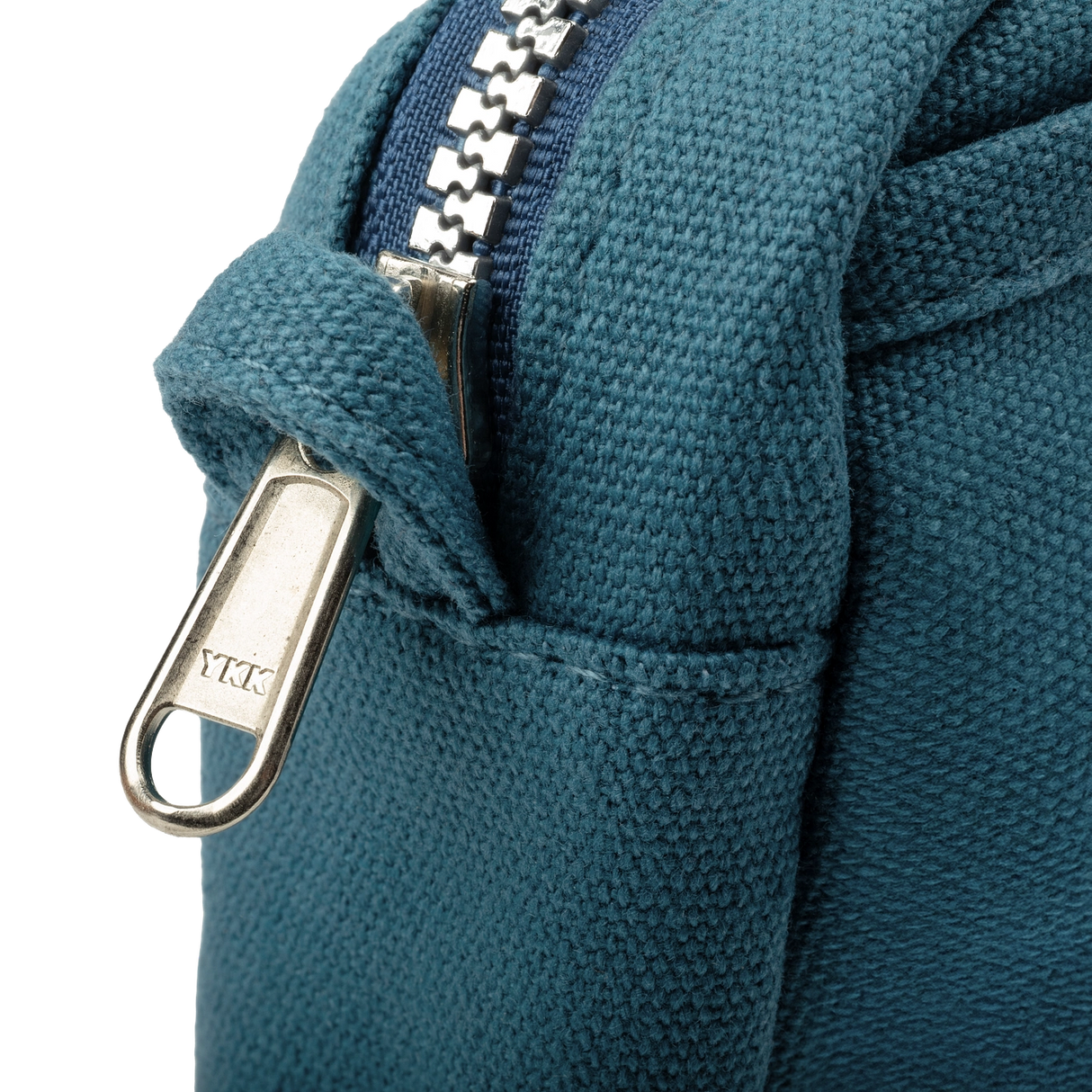 Front layout: 8 slanted pockets + 3 directly behind
Interior: Main compartment fits an A5 notebook; two open compartments on each wall
Back panel: 3 wide exterior pockets + one full-length slip pocket&nbsp;
Quick-drying duck canvas — sturdy, breathable, and machine-washable
Convertible design — hooks for your own strap or a Soolla strap (coming soon)&nbsp;
Structured silhouette — holds its shape even when lightly packed
Full-width YKK zipper — smooth and durable
Compact profile — fits inside larger bags or 