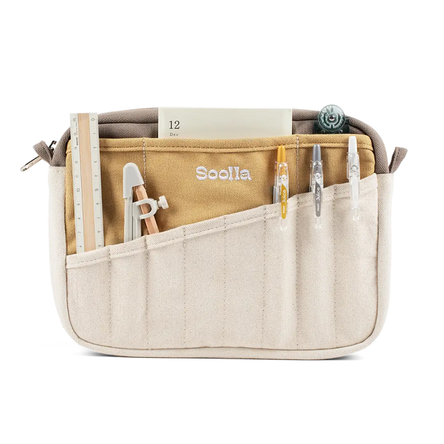 Soolla Studio Pouch - Driftwood

A compact carry-all pouch for artists, makers, and stationary lovers who appreciate a little order in their chaos. Structured enough to hold its form, soft enough to fit anywhere, and fully machine-washable for the days that get a little messy — your tools, pens, and creative essentials stay safe, visible, and ready wherever you go.

Inside, 20 pockets make space for art supplies, stationary essentials, and an A5 notebook, all secured by a smooth YKK zipper. Sized to fit wit