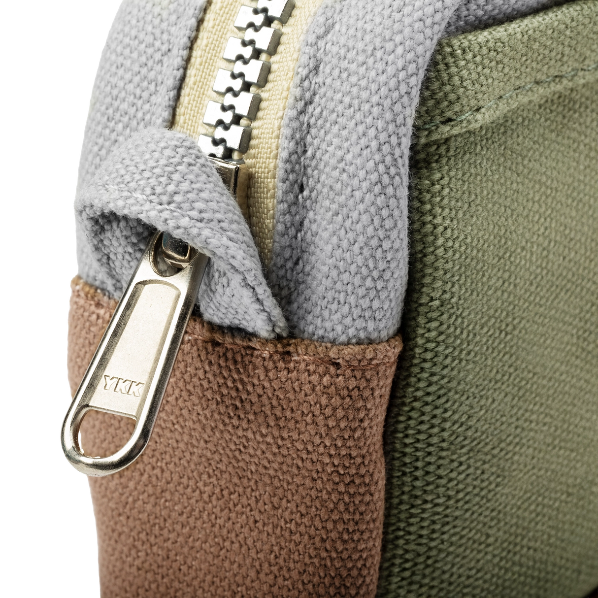 Features &amp; Specs

Front layout: 8 slanted pockets + 3 directly behind
Interior: Main compartment fits an A5 notebook; two open compartments on each wall
Back panel: 3 wide exterior pockets + one full-length slip pocket&nbsp;
Quick-drying duck canvas — sturdy, breathable, and machine-washable
Convertible design — hooks for your own strap or a Soolla strap (coming soon)&nbsp;
Structured silhouette — holds its shape even when lightly packed
Full-width YKK zipper — smooth and durable
Compact profile — fits 
