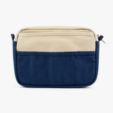 A compact carry-all pouch for artists, makers, and stationary lovers who appreciate a little order in their chaos. Structured enough to hold its form, soft enough to fit anywhere, and fully machine-washable for the days that get a little messy — your tools, pens, and creative essentials stay safe, visible, and ready wherever you go.

Inside, 20 pockets make space for art supplies, stationary essentials, and an A5 notebook, all secured by a smooth YKK zipper. Sized to fit within larger bags or carry on its o