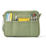 A compact carry-all pouch for artists, makers, and stationary lovers who appreciate a little order in their chaos. Structured enough to hold its form, soft enough to fit anywhere, and fully machine-washable for the days that get a little messy — your tools, pens, and creative essentials stay safe, visible, and ready wherever you go.

Inside, 20 pockets make space for art supplies, stationary essentials, and an A5 notebook, all secured by a smooth YKK zipper. Sized to fit within larger bags or carry on its o