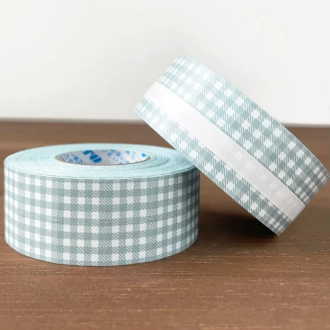 Stamp Marche Gingham Label Sticker Roll - Dusty Blue

Label stickers with Stamp Marche original designs.&nbsp;These are stickers originally for price tag applicators,now featuring a gingham check pattern!&nbsp;They can also be used to seal letters and envelopes, or as decorative materials for your planner. Fold them in half to use as index stickers or write or stamp them. Each pack contains 1,000 stickers with the same design, making them ideal for daily use or sharing.

Product Size: Approx. 55 x 21.6 mm i