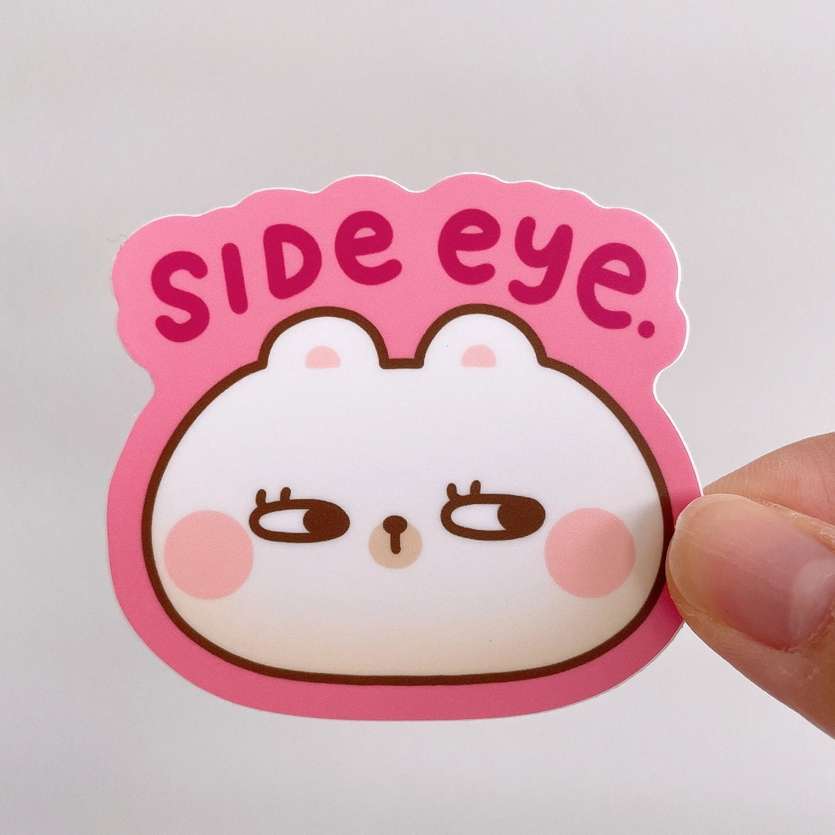 Rice the Bear gives you side eye... This heavy duty waterproof vinyl sticker is perfect for decorating any laptop, water bottle, iPad case, notebook cover, etc!

Details:

Heavy duty vinyl
Waterproof
Dimensions of sticker: approx 2.6 in x 2.4 in&nbsp;