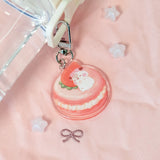 The Sweet Dreams keychains feature Muffin Corner characters sleeping on top of some of their favorite foods. Cocoroll is enjoying an afternoon nap on her strawberry macaron.

Details:

Approximate Dimensions: 1.” x 1.8” (4.1cm x 4.4cm)
Material: Acrylic
Double-sided
Comes with 1 Keychain