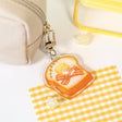 The Sweet Dreams keychains feature Muffin Corner characters sleeping on top of some of their favorite foods. Devyegg is sleeping a warm piece of toast after a late night of working.

Details:

Approximate Dimensions: 1.6” x 1.8” (4.1cm x 4.4cm)&nbsp;
Material: Acrylic
Double-sided
Comes with 1 Keychain
