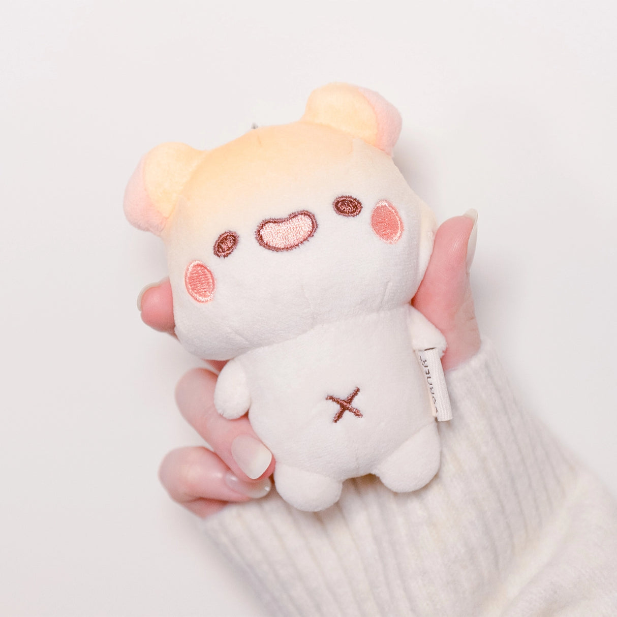 A cute Muffinmaru plush Keychain made of soft and premium materials. Comes with a detachable chain so you can bring this mini Muffinmaru will on many foodie adventures with you.

Approximate Dimensions: plush part 4.5" tall (11cm)
Hand wash only and do not tumble dry, dry clean or iron