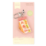 The Konbini (コンビニ) series keychains feature delicious food with cute packaging. This sandwich is full of fresh fruits and cream, packed in a bag with Muffinmaru’s little face.

Details:

Approximate Dimensions: 1.5” x 1.9” (3.9cm x 4.9cm
Material: Acrylic
Double-sided
Comes with 1 Keychain