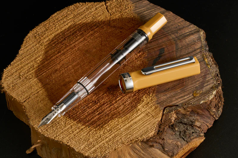 TWSBI ECO Bahama Yellow Fountain Pen

Comes in EF, F, M, B, Stub1.1&nbsp;nib choices
Colors: Yellow/Clear

Pen cap is able to post onto the back of the pen

Piston Filler Fountain pen.
Simply unscrew the end cap, dip into ink, screw back the end cap, and your done! Ready to write!!