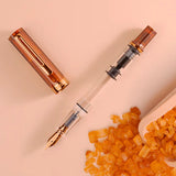 Comes in&nbsp;EF, F, M, B, Stub1.1 nib choices

Colors: Creme/Clear/RoseGold&nbsp;

Pen cap is&nbsp;able to post&nbsp;onto the back of the pen

Piston Filler Fountain pen.
Simply unscrew the end cap, dip into ink, screw back the end cap, and you're done! Ready to write!!

Pen cap has an inner cap to ensure a perfect seal when stored away.&nbsp;
Made for the beginner who just wants to try out fountain pens, all the way to the experts. A good everyday worker.

Please note: Ink is NOT included

A quick no brai
